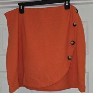 Maeve Asymmetrical Skirt in Bold Orange with Button Accents